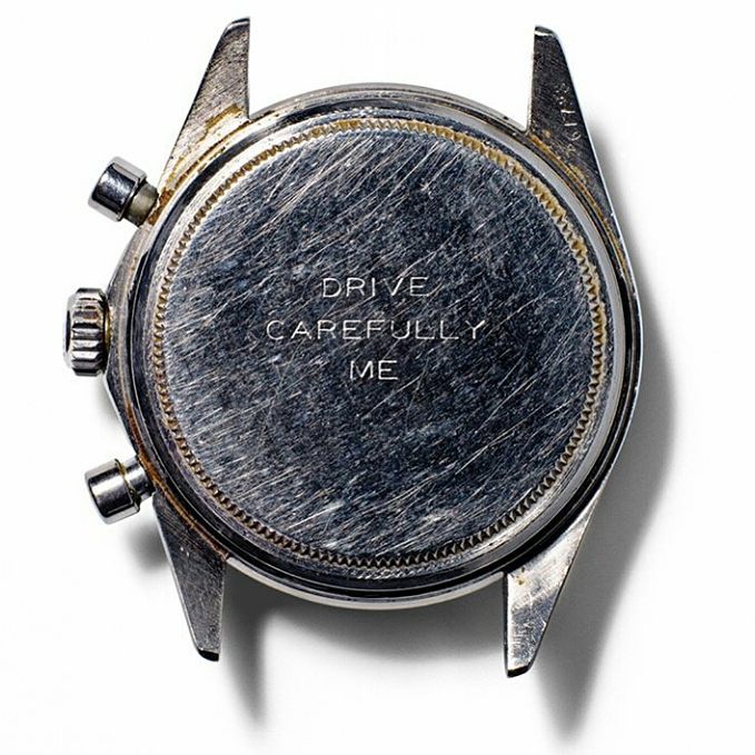 The back of the watch engraved with Drive Carefully Me from Newman's wife
